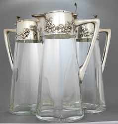 GERMAN SILVER AND CLARET JUGS